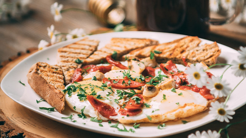 A plate of food with eggs and toast.