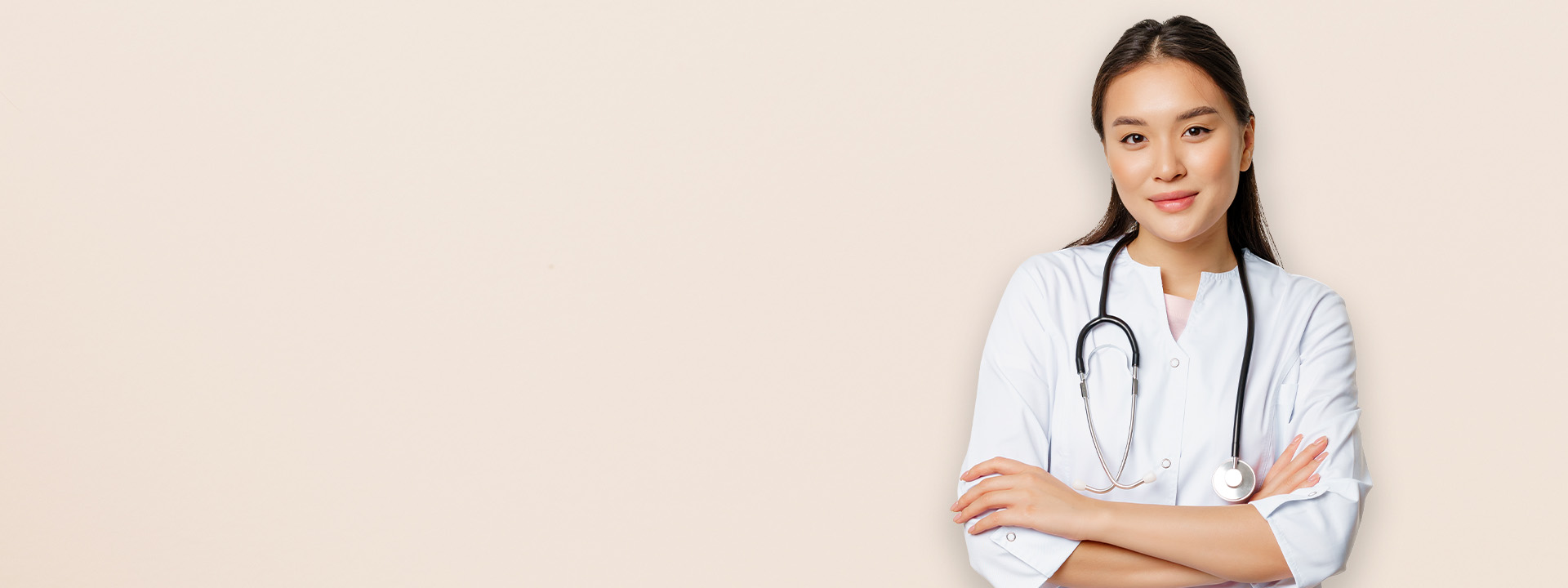 A doctor in a white coat with a stethoscope around her neck