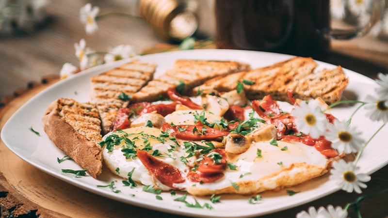 A plate of food with eggs and toast.