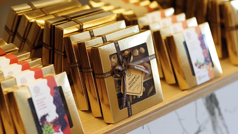 The author's packaged chocolate is put on the shelves