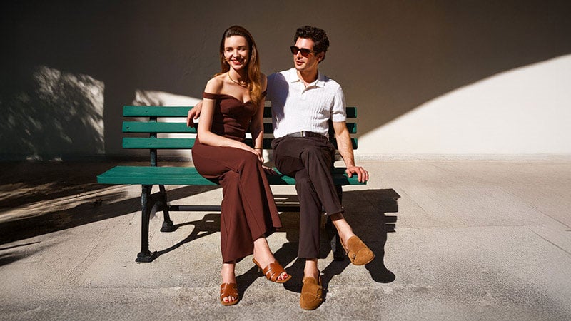 Two people sitting on a bench